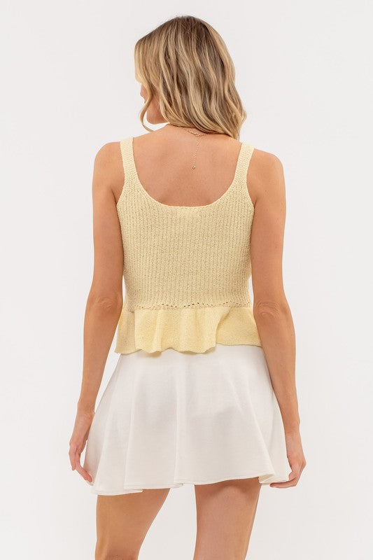yellow sleeveless knit peplum top