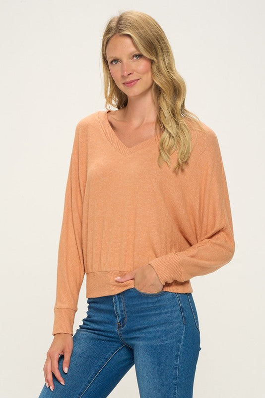 orange v neck dolman sleeve top