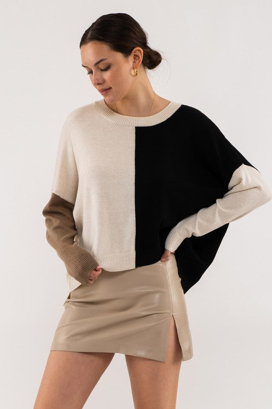 black and cream color block sweater