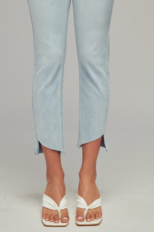 Light wash straight leg curved hem jeans