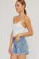 medium wash button fly distressed shorts