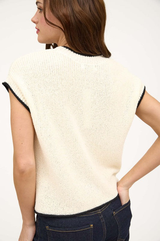 cream top with black trim
