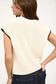 cream top with black trim