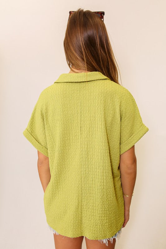 green short sleeve collared shirt