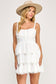 white sleeveless ruffle short dress