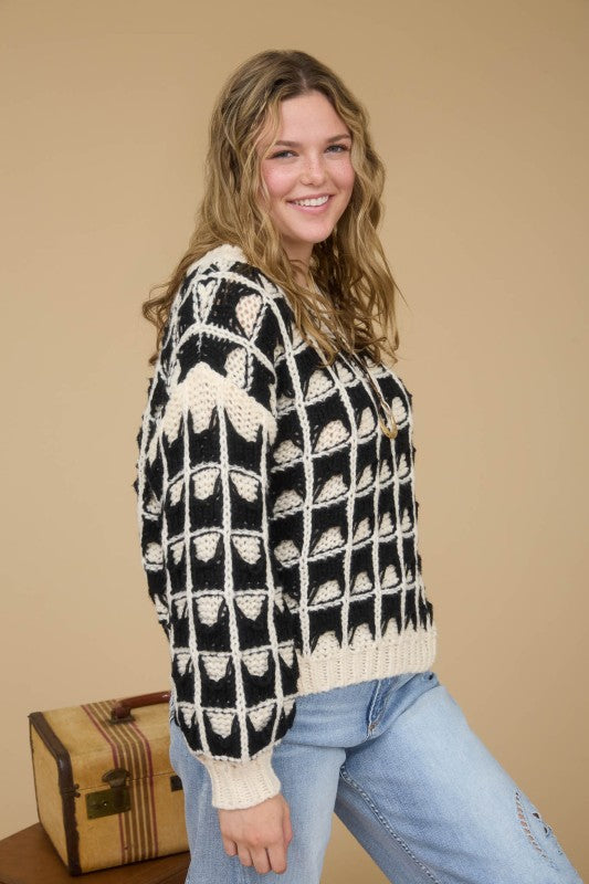 black and cream knit long sleeve sweater