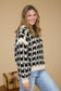 black and cream knit long sleeve sweater