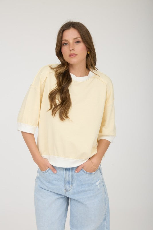 light yellow boxy short sleeve relaxed top