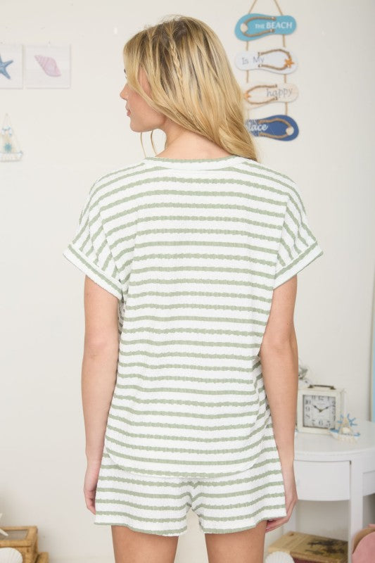 green and cream striped short sleeve shirt