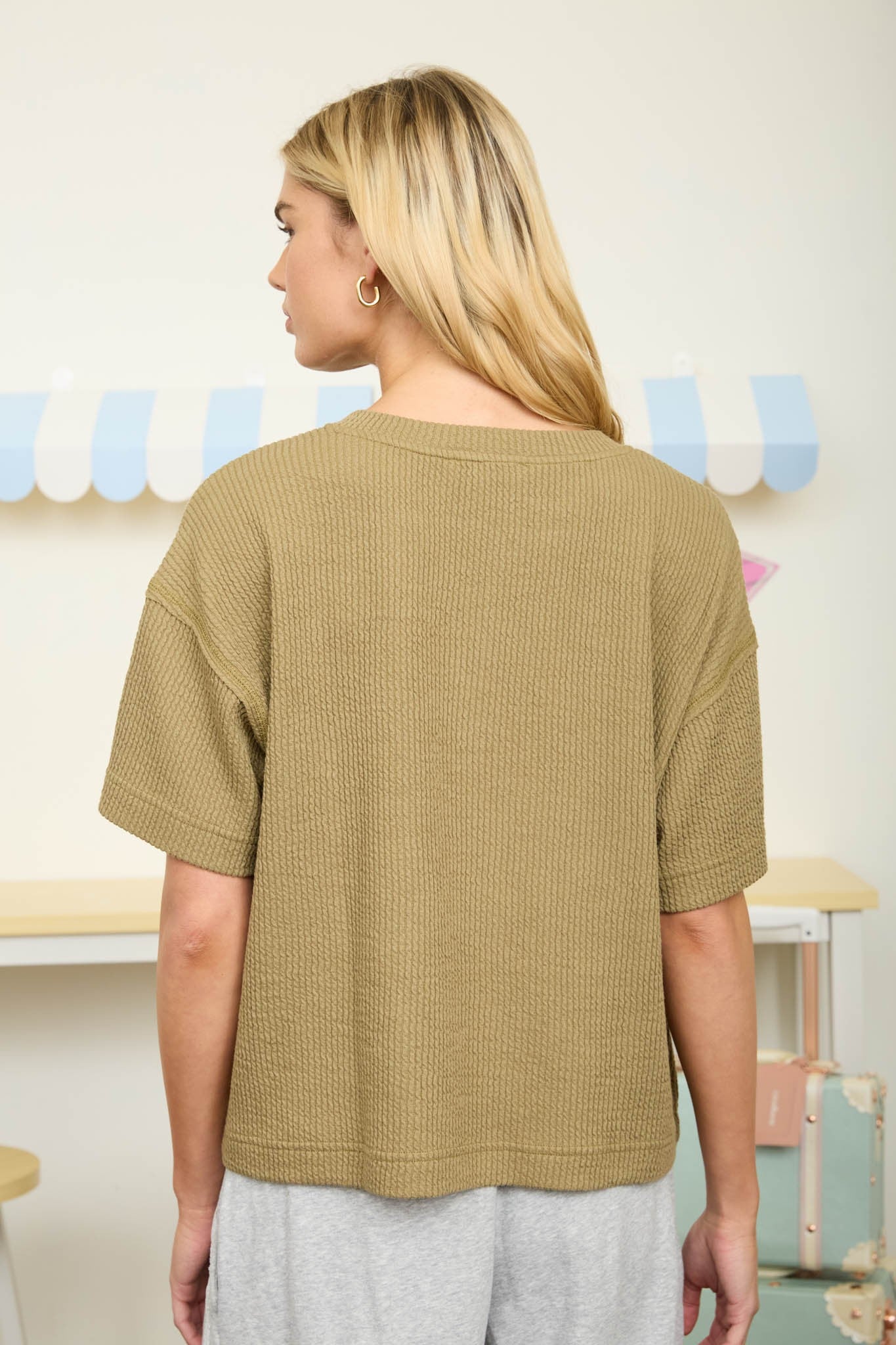 green boxy short sleeve ribbed top