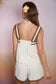 oatmeal sleeveless brown trim top