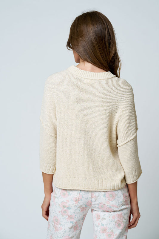 cream quarter length sleeve knit top