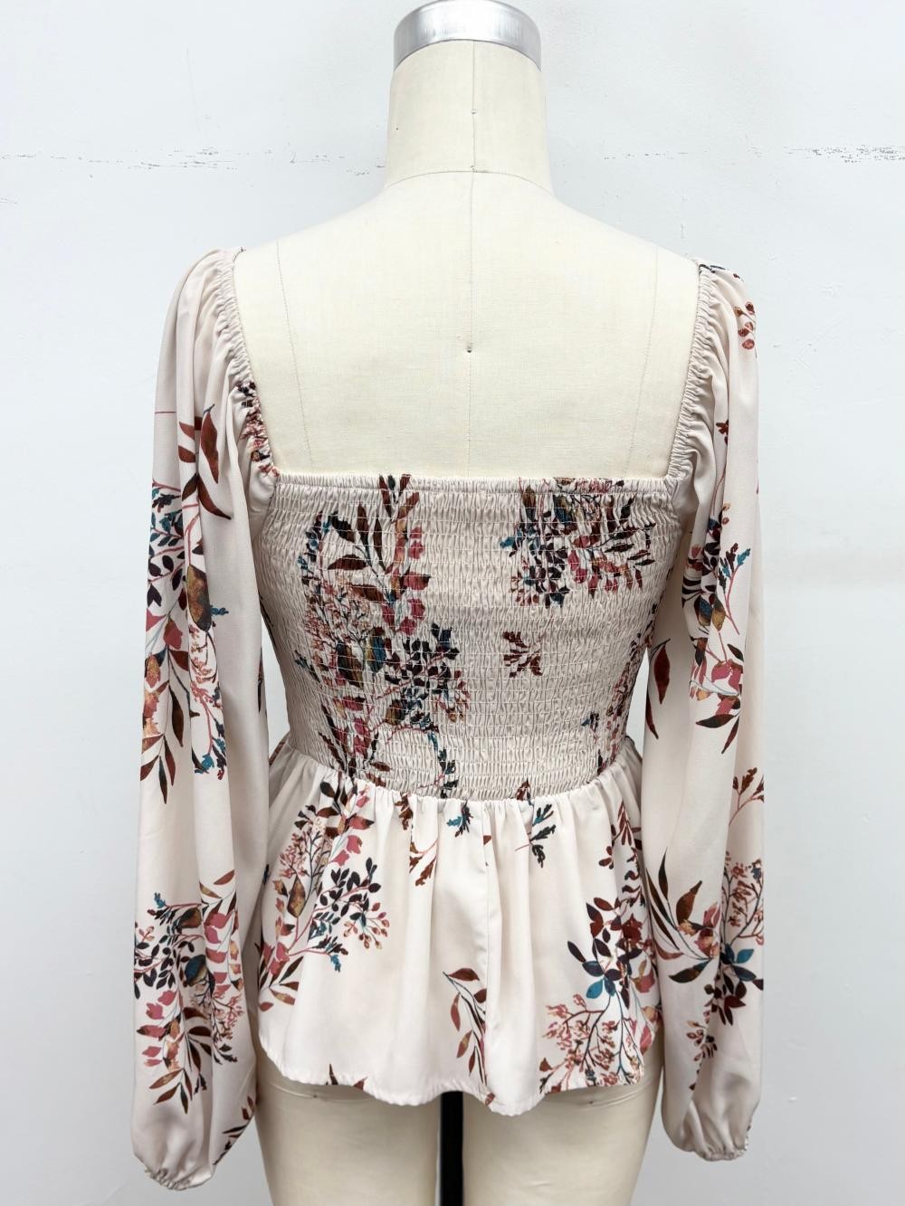 cream long sleeve smocked peplum top