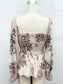 cream long sleeve smocked peplum top