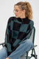 green and black checker pattern sweater