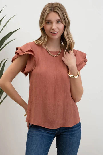 rust ruffle pom pom sleeve top