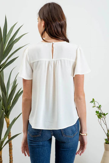 cream flowy short sleeve top