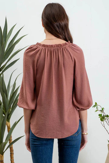 rust quarter length sleeve flowy top